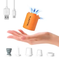 FLEXTAIL Tiny Pump X shown inflating a camping mat next to a tent – compact air pump and lantern for hiking and outdoor adventures.
